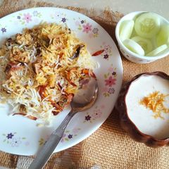 A picture of Jackfruit Biryani with Burani raita.
