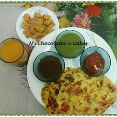 A picture of Garari(Spiced Gram Flour Pancakes) and Traditional Thabak Variyun.