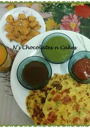 A picture of Garari(Spiced Gram Flour Pancakes) and Traditional Thabak Variyun.