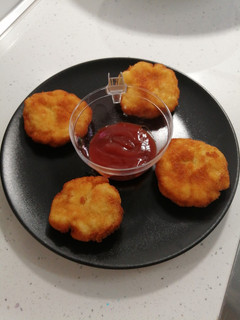 Una foto de Nugget de pollo con toque al curry