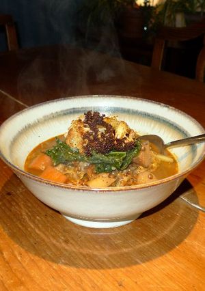 A picture of Puy lentil stew with baked cauliflower and steamed cavolo nero.