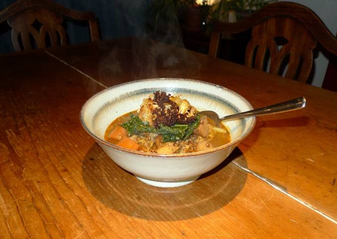 Puy lentil stew with baked cauliflower and steamed cavolo nero