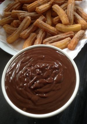 A picture of Churros and chocolate dip.