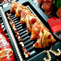 A picture of Veggies Stuffed Cheesy Beetroot Baked Samosas.