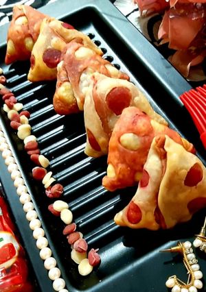 A picture of Veggies Stuffed Cheesy Beetroot Baked Samosas.
