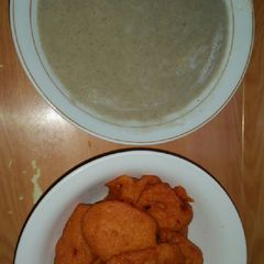 A picture of Pap made with millet and Akara(beans cake).
