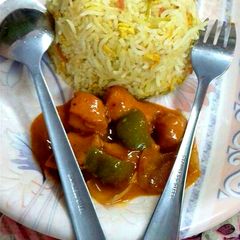 A picture of Egg and Garlic Rice with Chicken hot sauce Manchurian.