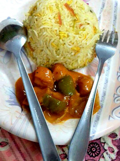 A picture of Egg and Garlic Rice with Chicken hot sauce Manchurian.