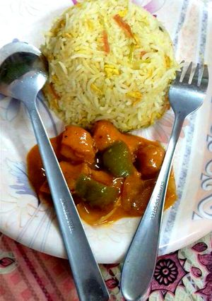 A picture of Egg and Garlic Rice with Chicken hot sauce Manchurian.