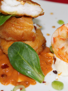 Una foto de Nuggets de merluza con salsa chipotle y langostino