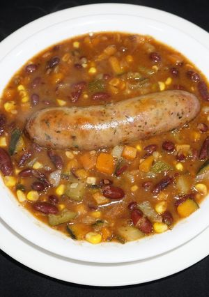A picture of Red kidney beans soup with vegetables and Italian sausages.