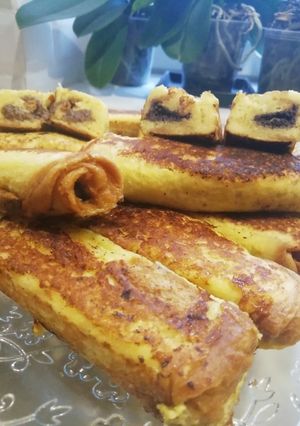Une photo de Roulés de brioche perdu, fourés à la pâte à tartiner vegan