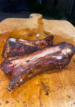 Foto di Costine di maiale con pancetta al BBQ