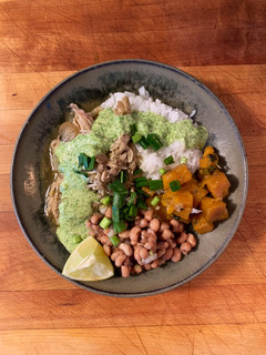 A picture of Peruvian Shredded chicken and cilantro sauce.
