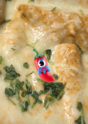 Una foto de Enchiladas de chile Guajillo y tomates verdes