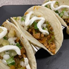 A picture of Pineapple Salsa Pork Tacos.