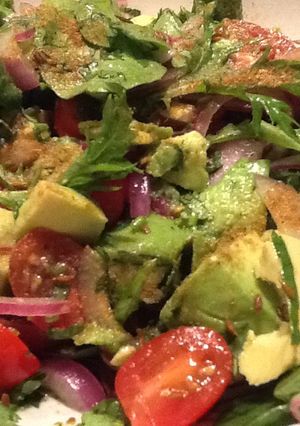 A picture of Mexican avocado salad w tomato, lime, toasted cumin.