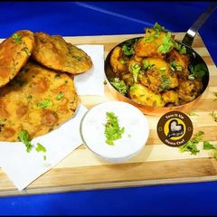 Aloo ke Gutke And Methi Poori A picture of Aloo ke Gutke And Methi Poori.