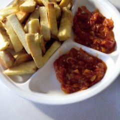 A picture of Fried sweet potatoes and stew.