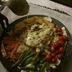 A picture of Homemade Chicken Sizzler on a Tawa.