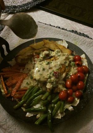 A picture of Homemade Chicken Sizzler on a Tawa.