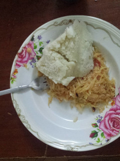 A picture of Ugali and fried cabbage.