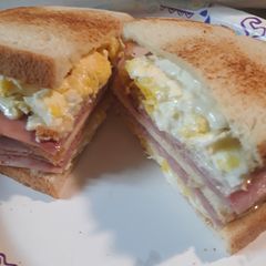 A picture of Ham Egg and Swiss on Sourdough.