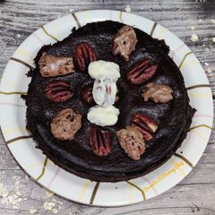 A picture of Baked oats with pecans topping.