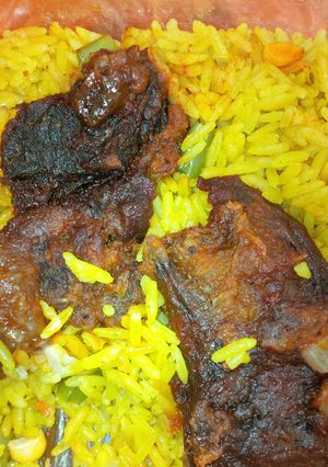 A picture of Fried rice and fried beef.