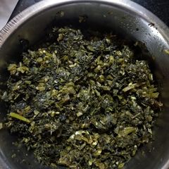 A picture of Sorse-saag bhaja(mustard leaves stir fry).