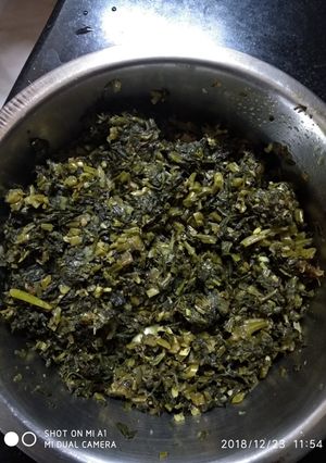 A picture of Sorse-saag bhaja(mustard leaves stir fry).