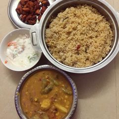 Veg&non-veg Combo(Ghee coconut Rice,Sambar,Chicken Fry,Raita) A picture of Veg&non-veg Combo(Ghee coconut Rice,Sambar,Chicken Fry,Raita).