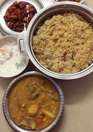 A picture of Veg&non-veg Combo(Ghee coconut Rice,Sambar,Chicken Fry,Raita).