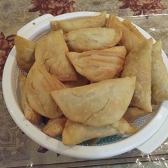 A picture of Gujiya (A sweet deep fried dumpling made from suji & maida).