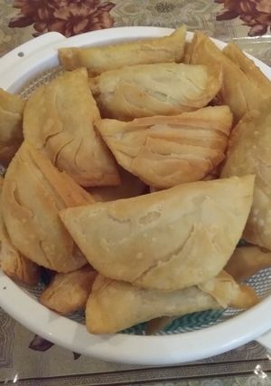 A picture of Gujiya (A sweet deep fried dumpling made from suji & maida).