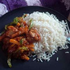 A picture of Stir Fry Sauce with White Rice.
