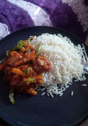 A picture of Stir Fry Sauce with White Rice.