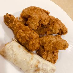 A picture of Chicken broast with egg roll.