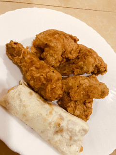 A picture of Chicken broast with egg roll.