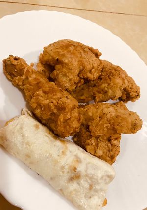 A picture of Chicken broast with egg roll.