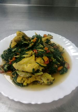 A picture of Boiled chicken with spinach.