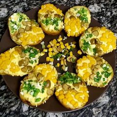 Baked potatoes loaded with cheese😋 A picture of Baked potatoes loaded with cheese😋.