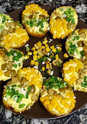 A picture of Baked potatoes loaded with cheese😋.
