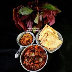 A picture of Calcium Rich Red Amaranth Brinjal Tomato Curry.