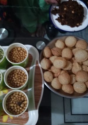 A picture of Homemade golgppe and spicey and meetha pani.