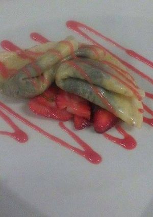 A picture of Crepe Nutella with a Strawberry Compote.