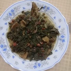 A picture of Mkundeleaves and matumbo in coconut milk.