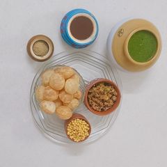 A picture of Mint Pani Puri with Chana–Potato Stuffing.