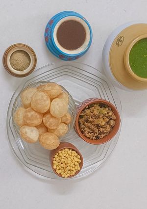 A picture of Mint Pani Puri with Chana–Potato Stuffing.