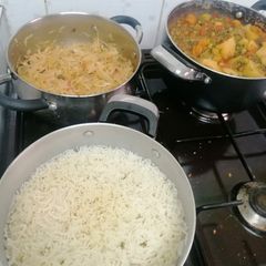 A picture of Mixed vegetable stew with minced meat, rice and a side of cabbage.